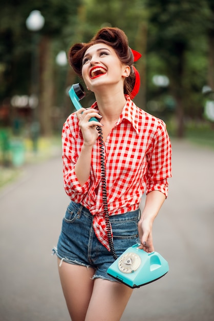 Premium Photo  Smiling pinup girl with retro rotary phone, vintage  american fashion. sexy woman in pin up style