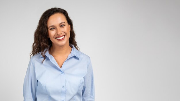 Smiling pretty millennial caucasian lady manager in formal wear