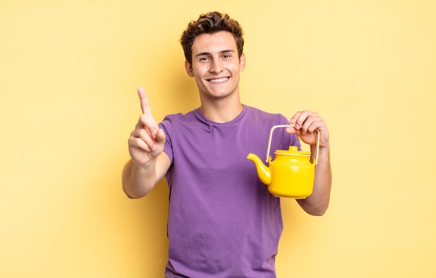 Smiling proudly and confidently making number one pose triumphantly, feeling like a leader. teapot concept