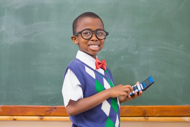 Smiling pupil using calculator 