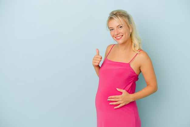 Smiling and raising thumb up