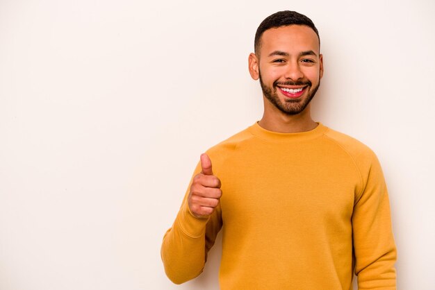 Smiling and raising thumb up