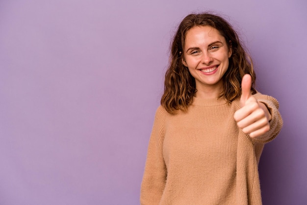 Smiling and raising thumb up