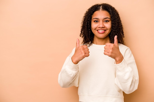 Smiling and raising thumb up