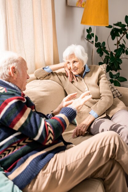 Smiling Senior Couple Chatting at Home