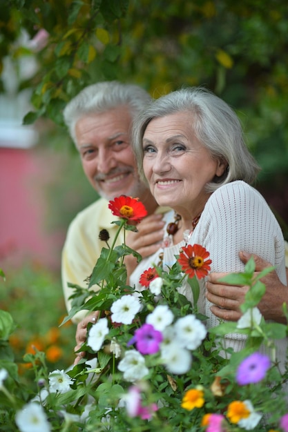 Smiling senior couple posing in park