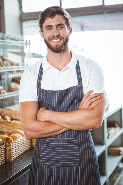  Smiling server in apron arm crossed