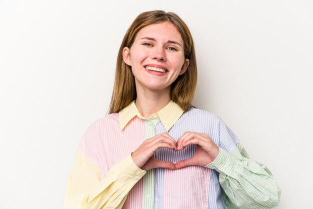 smiling and showing a heart shape with hands.