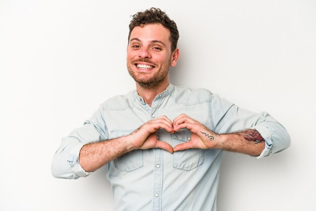 Smiling and showing a heart shape with hands