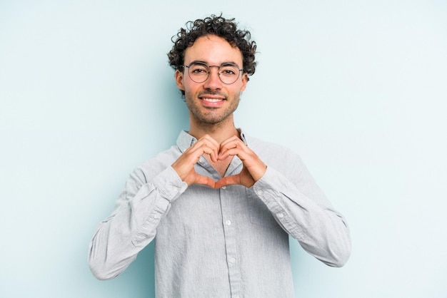 Smiling and showing a heart shape with hands