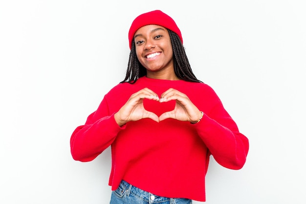 Smiling and showing a heart shape with hands