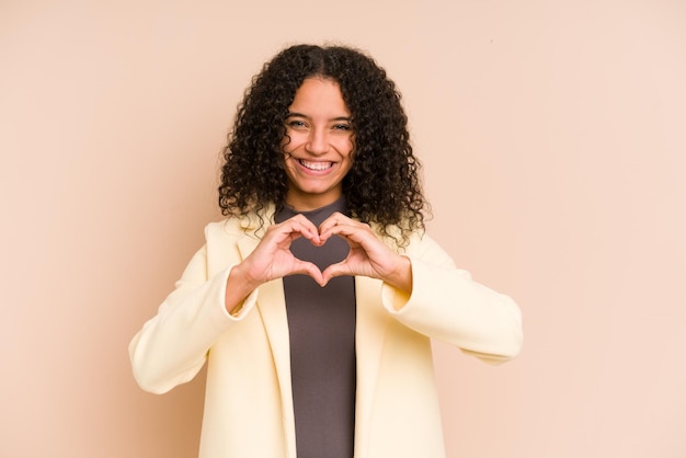 Smiling and showing a heart shape with hands