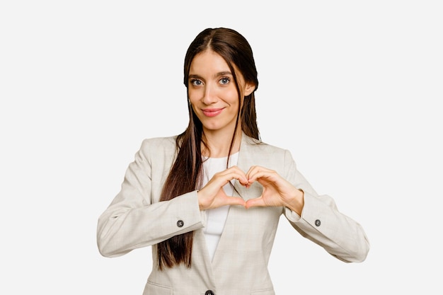 Smiling and showing a heart shape with hands