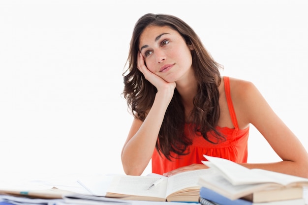 Smiling student doing her homework