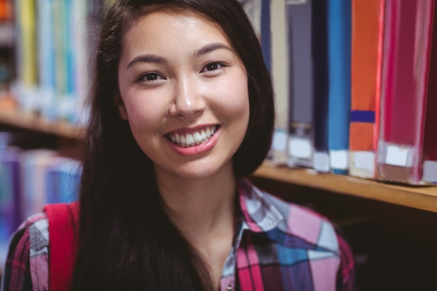 Smiling student in library