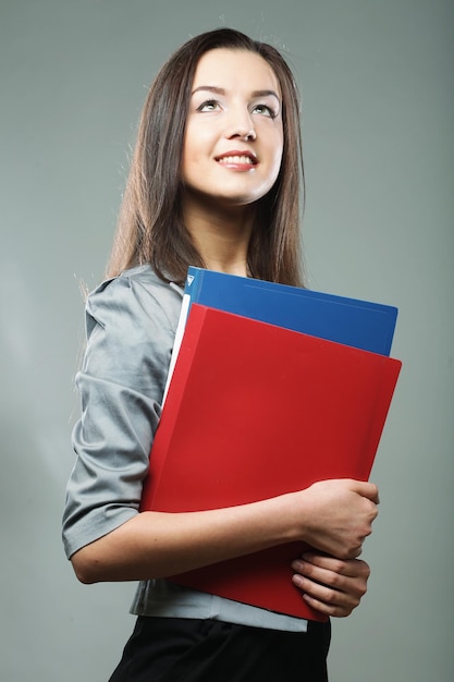 Smiling student woman with folders