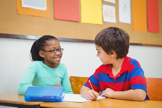 Smiling students looking at each other