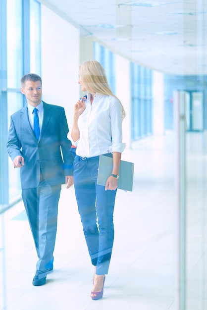 Smiling successful business team standing in office business