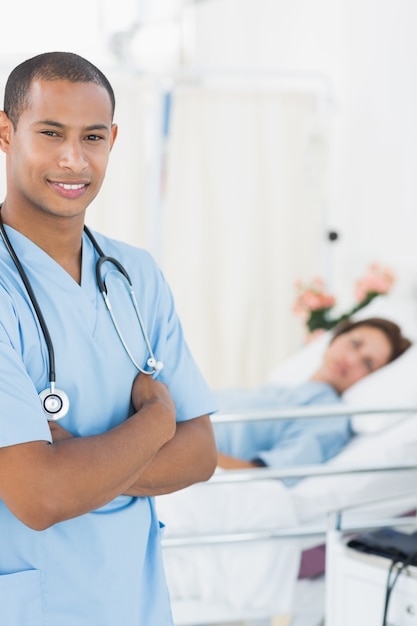 Smiling surgeon with patient at hospital