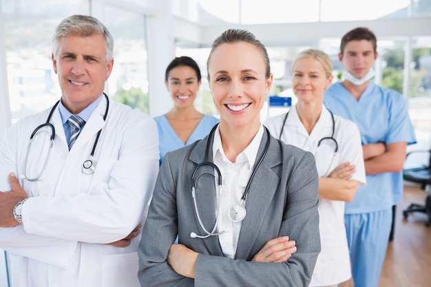 Smiling team of doctors looking at camera