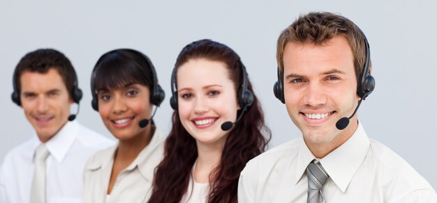 Smiling team working in a call center