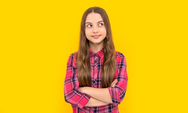 Smiling teen girl isolated on yellow teen girl in studio teen girl on background