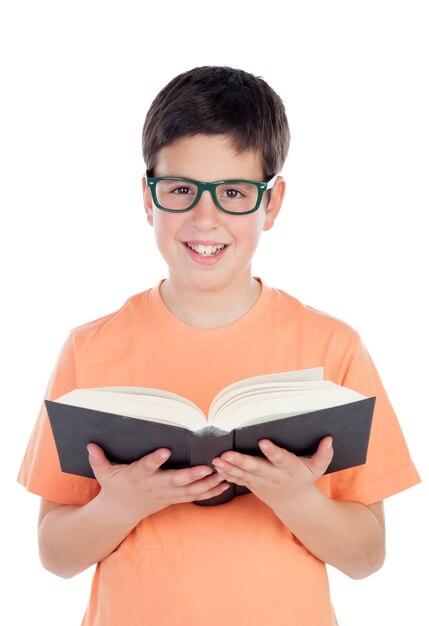 Smiling teenage boy of thirteen reading a book