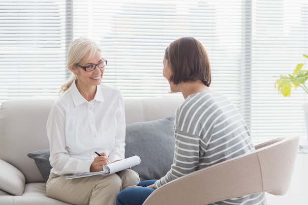 Smiling therapist with patient