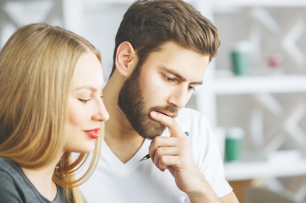 Smiling thoughtful european man and woman