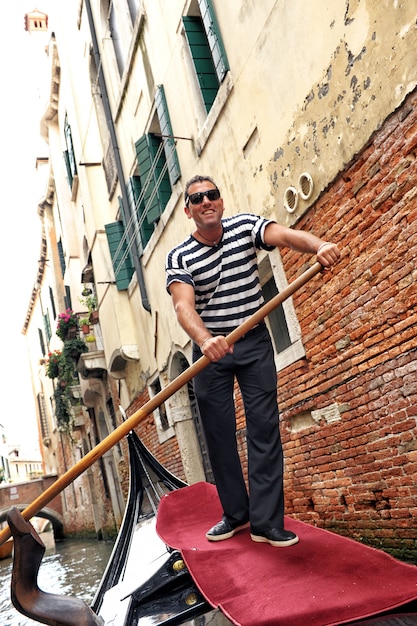 Smiling venetian gondolier