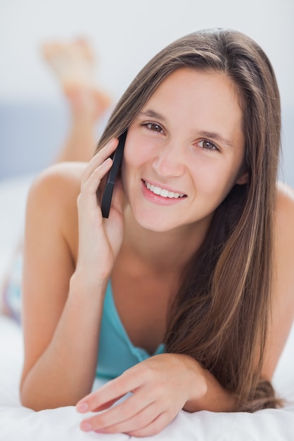 Smiling woman in bed