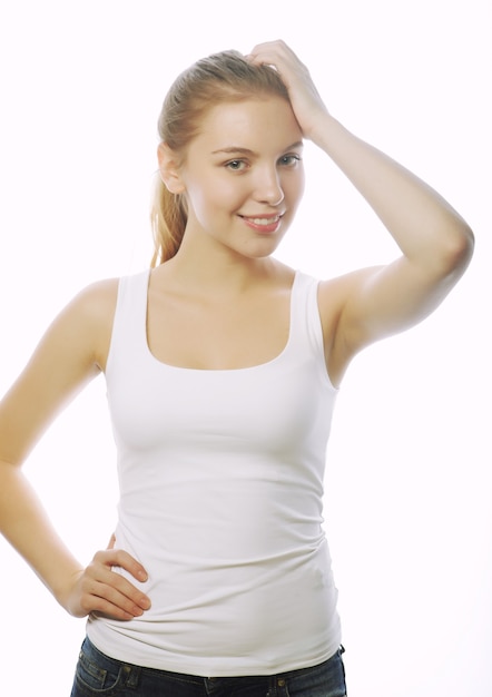 Smiling woman in blank white t-shirt isolated on white