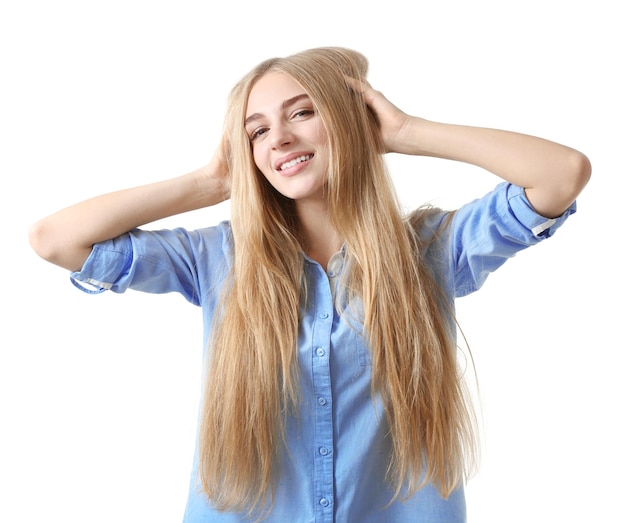 Smiling woman in blue shirt on white background