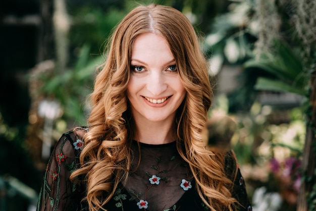 Smiling woman in the botanic garden