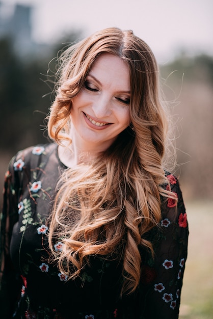 Smiling woman in the botanic garden