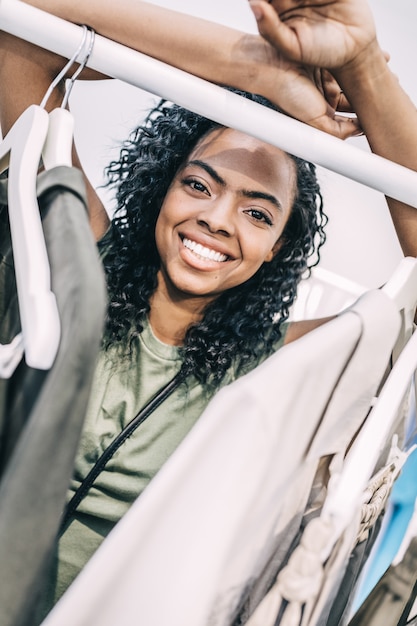 Smiling woman in clothes shop