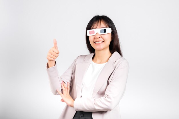 Smiling woman confidence wearing 3d cinema movie glasses red and blue isolated white background, Asian happy portrait beautiful young female in television film studio shot, copy space