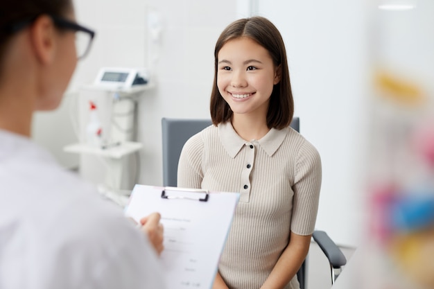 Smiling woman in Doctors Office