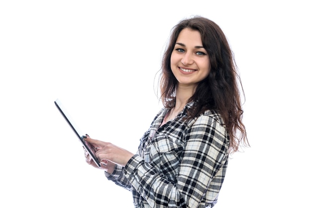 Smiling woman holding tablet isolated on white wall