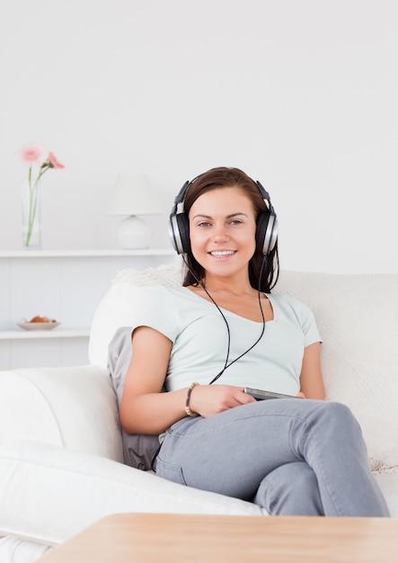 Smiling woman listening to music