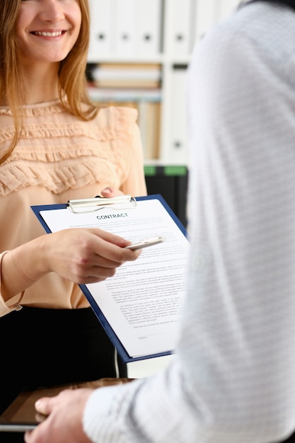 Smiling woman offer contract form