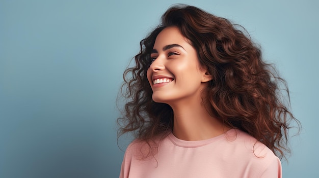 Smiling woman posing in studio with blank background