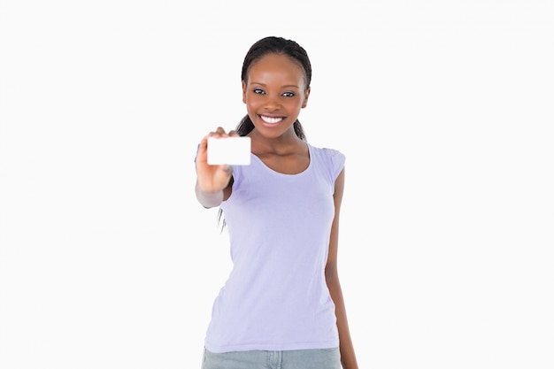 Smiling woman presenting business card on white background