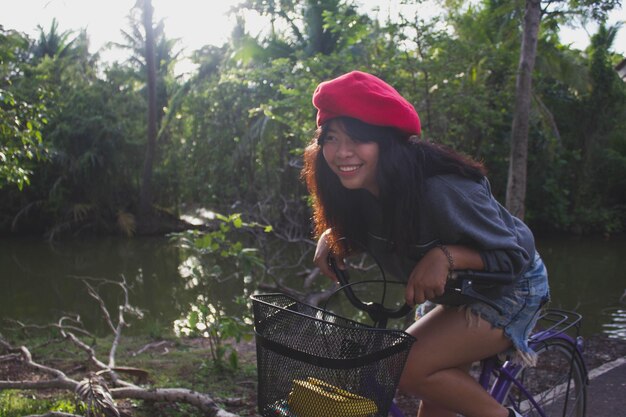 Smiling woman riding bicycle