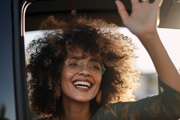 Smiling woman says hello sitting in car Travel gesture and people concept smiling young african american woman waving hand happy