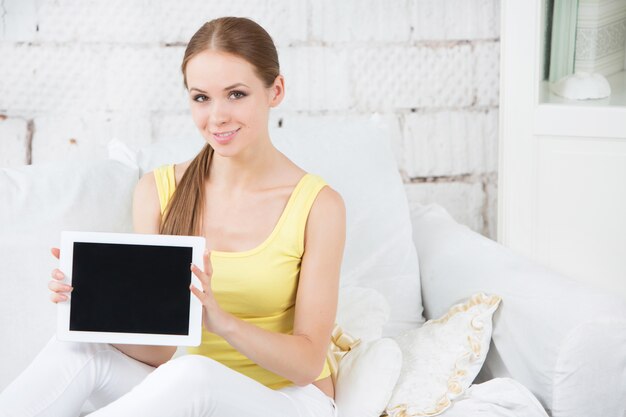 Smiling woman showing touchpad