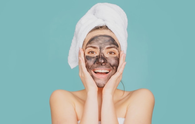 Smiling woman spa mask beauty concept healthy portrait mud facial mask face clay mask spa beautiful