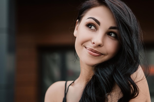 Smiling woman standing outside