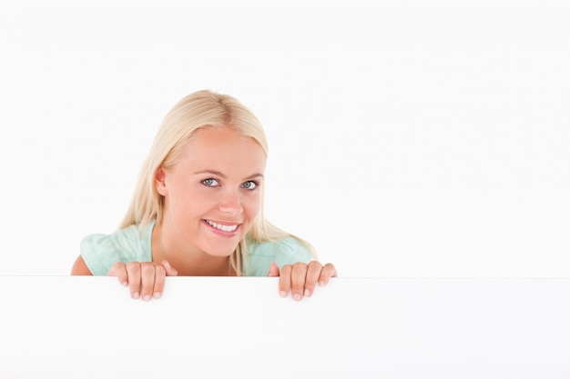 Smiling woman standing behind a whiteboard