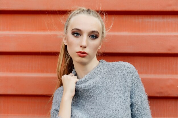 Smiling woman in sweater looking at the camera